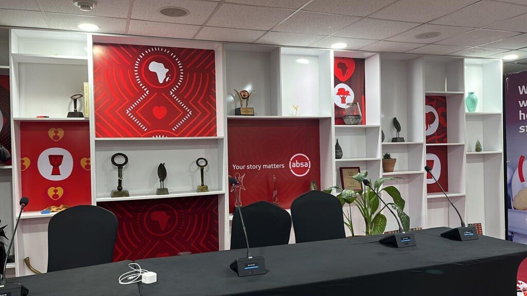 Custom-branded corporate event stage with backdrop, podium and sponsor logos in Nairobi