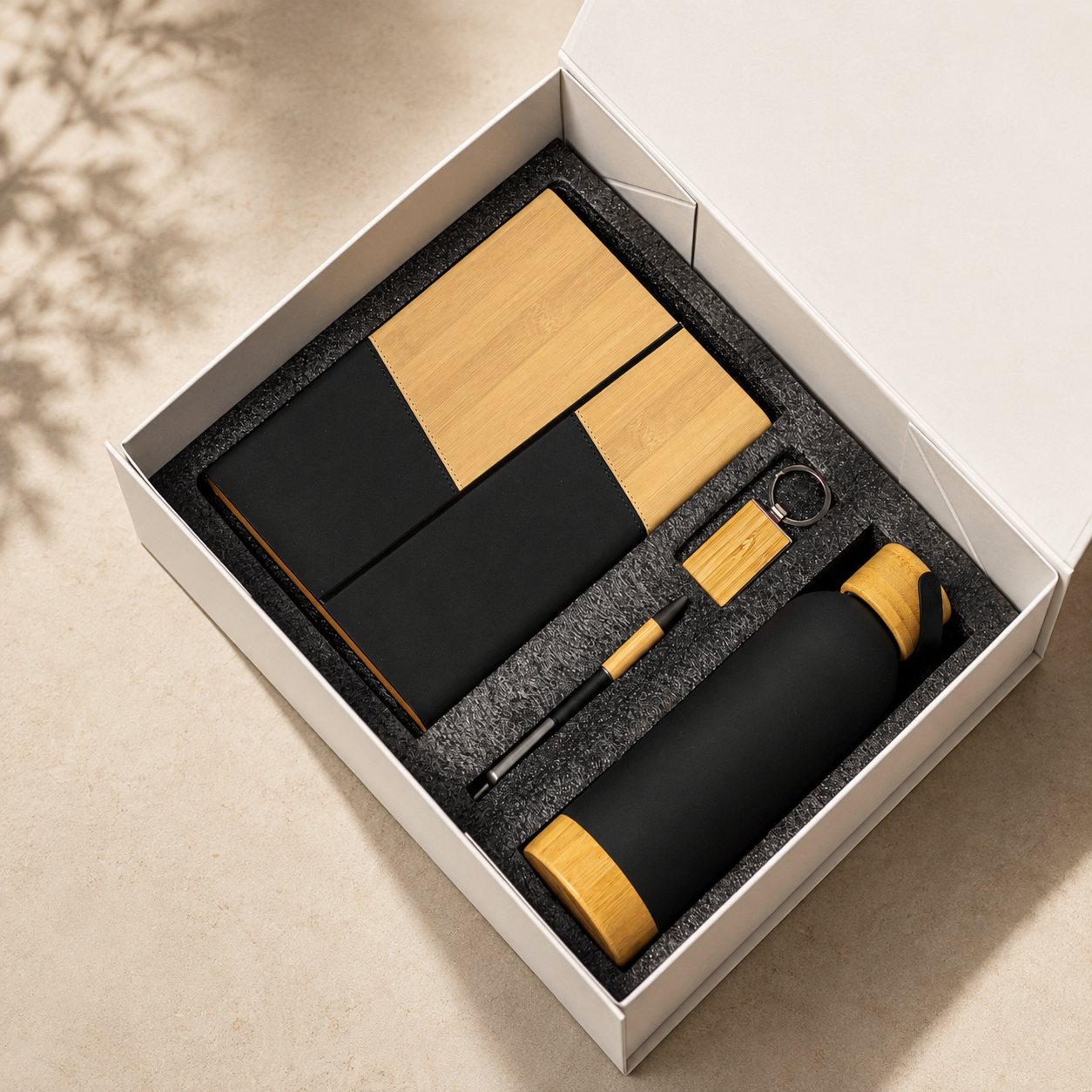 Two-tone notebook, pen, keyring and wood-accent bottle in a gift box