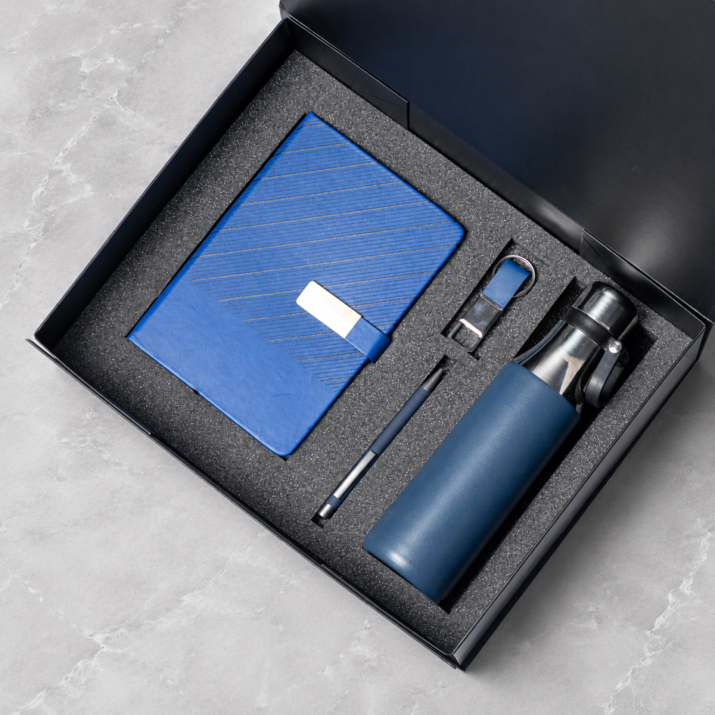 Wave-pattern notebook, pen and flask in a presentation box