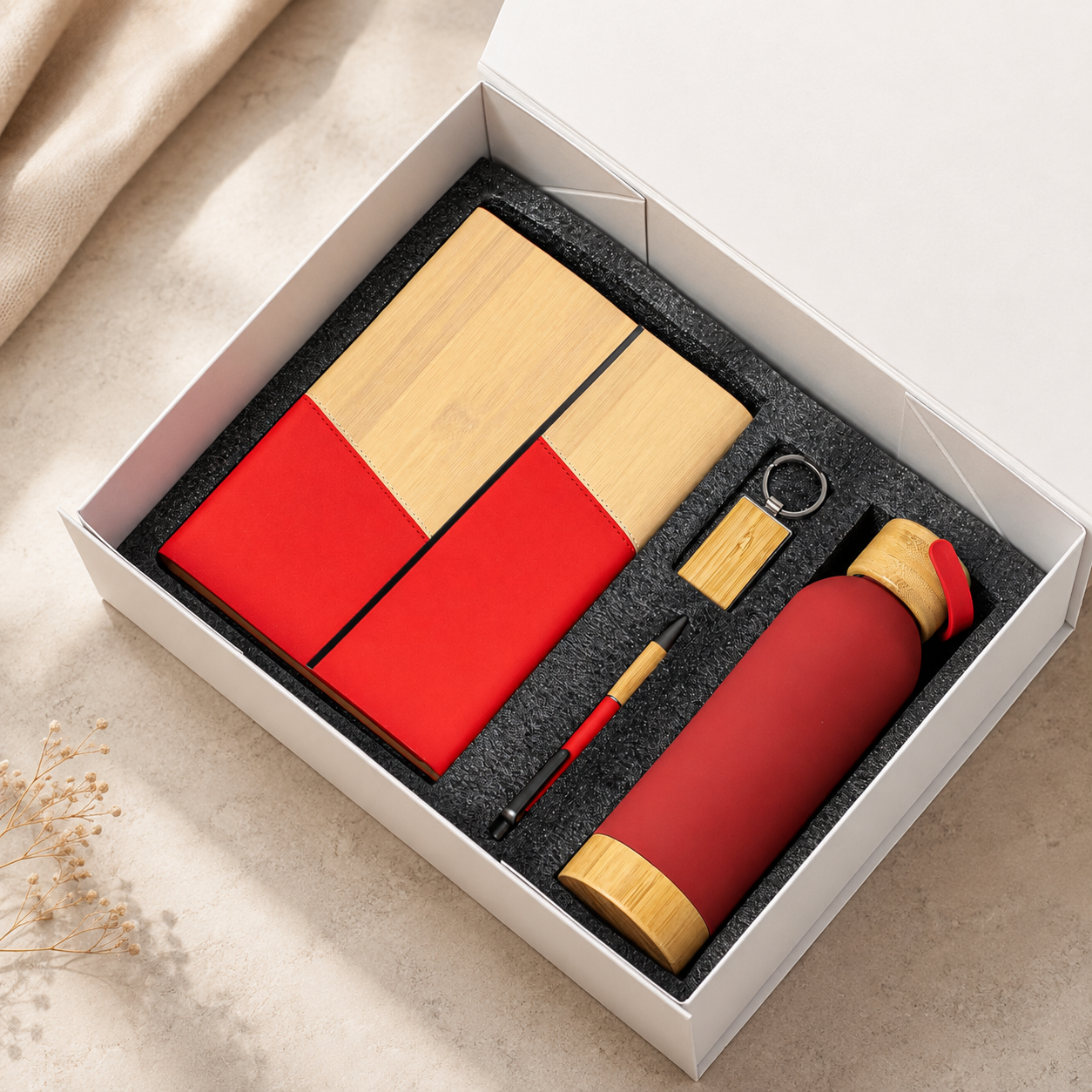 Two-tone notebook, pen, keyring and wood-accent bottle in a gift box