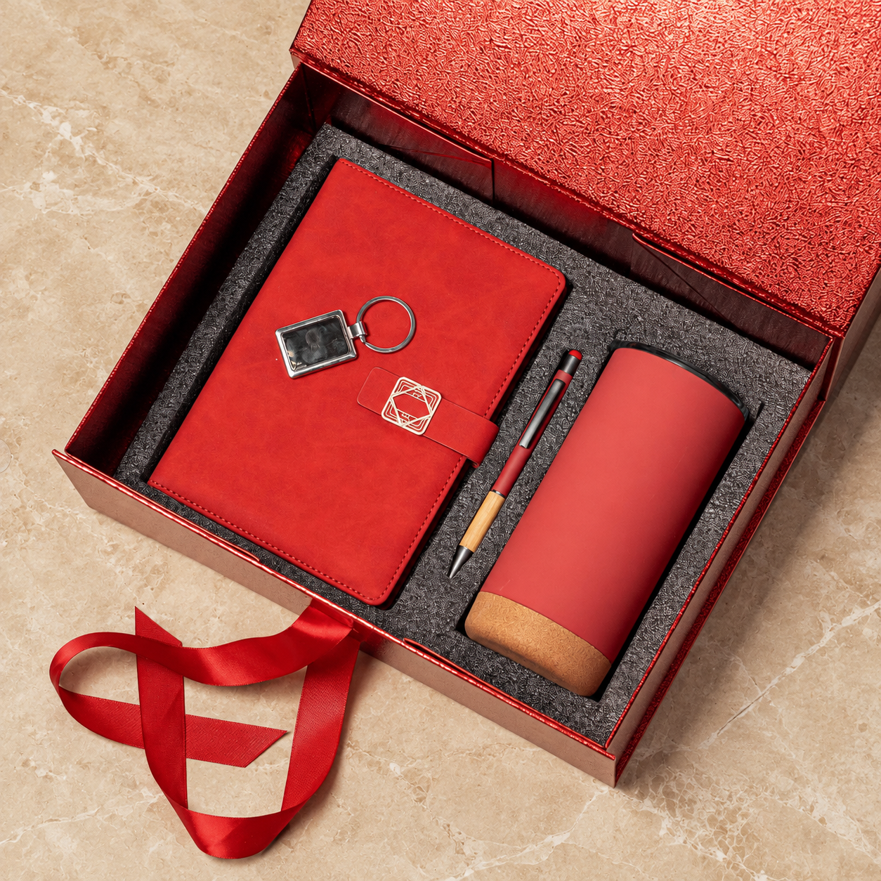 Notebook, pen, keyring and cork-base tumbler in a gift box