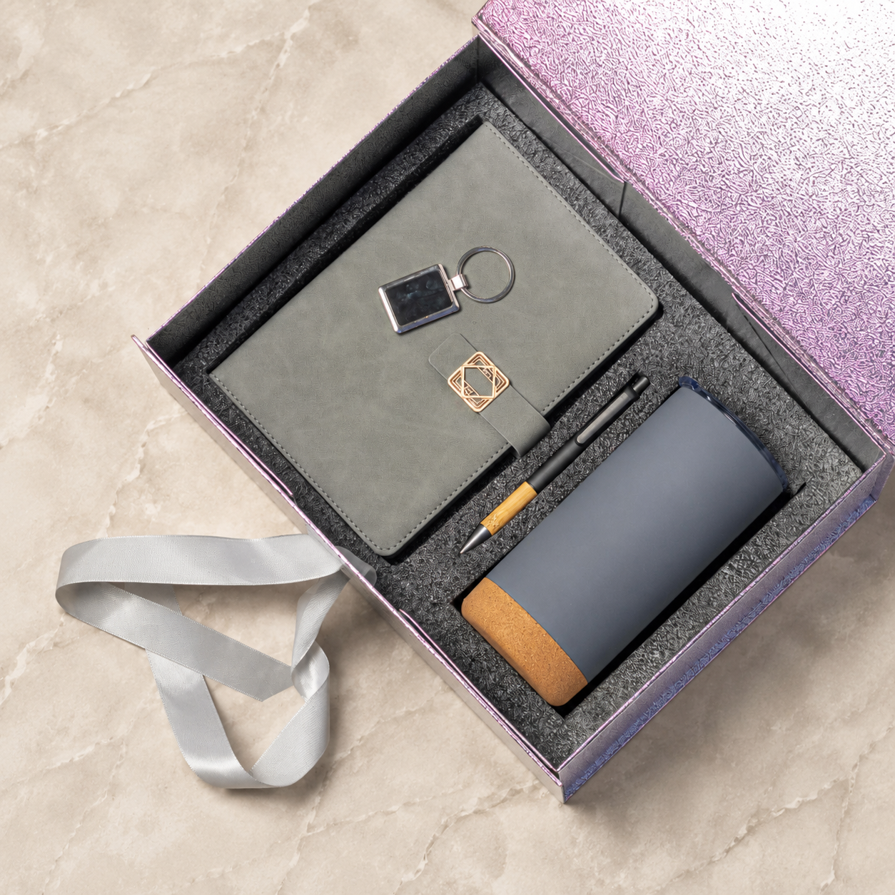 Notebook, pen, keyring and cork-base tumbler in a gift box