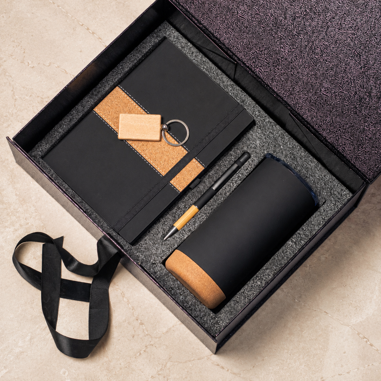 Notebook, pen, keyring and cork-base tumbler in a gift box