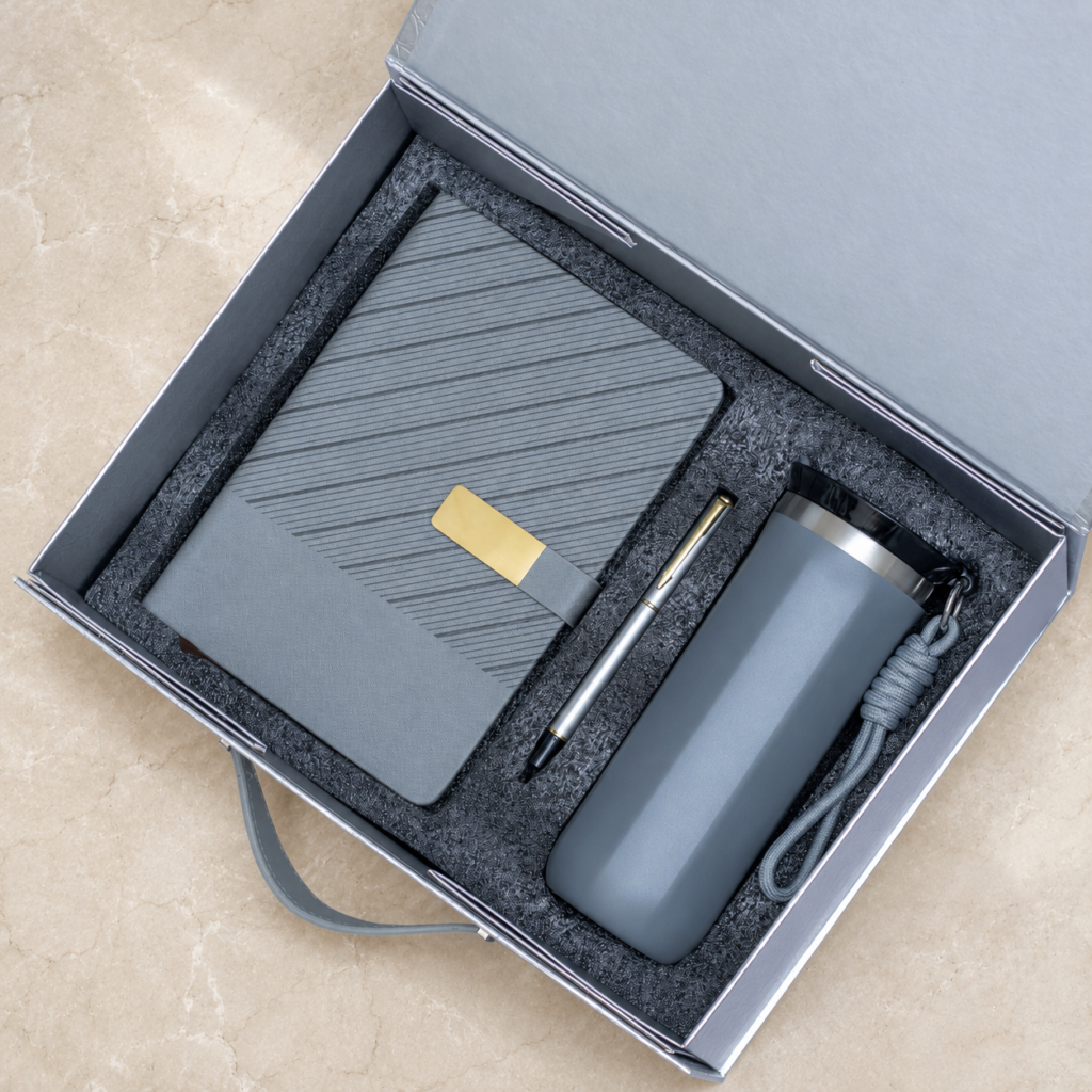 Wave-pattern notebook, pen and flask in a presentation box