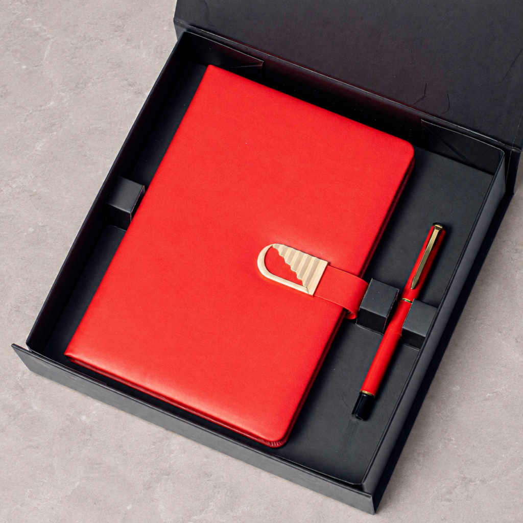 Notebook with gold-tone clasp and matching pen in a gift box