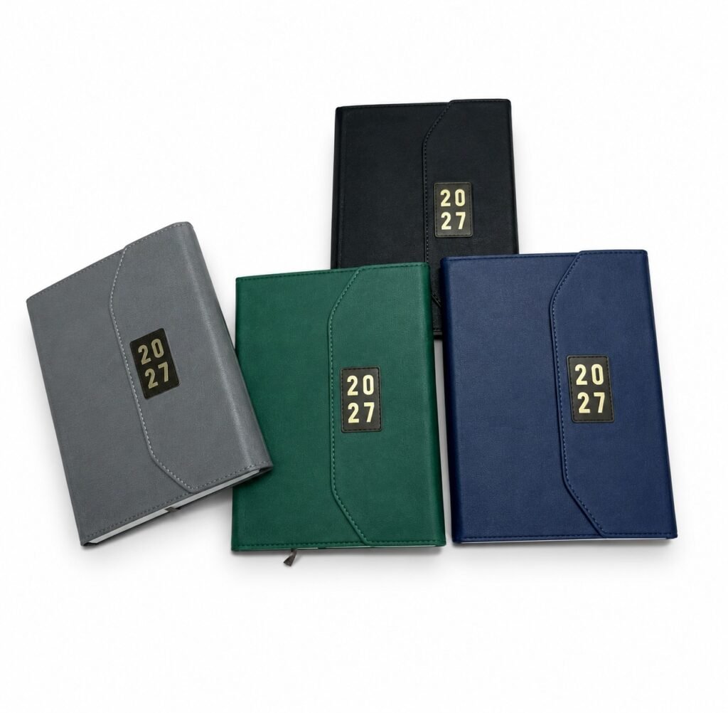 Four colours of A5 2027 diary design 545 with curved flaps and rectangular year badges on white
